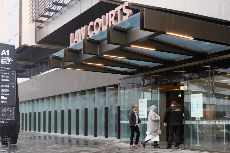 CHRISTCHURCH, NEW ZEALAND - JUNE 14: Members of the Muslim community walk past police officers at Christchurch High Court on June 14, 2019 in Christchurch, New Zealand. Accused gunman Brenton Harrison Tarrant is now facing 51 charges of murder and 40 of attempted murder as well as a engaging in a Terrorist Act after opening fire at Al Noor Mosque and the Linwood Islamic Centre in Christchurch on Friday, 15 March. 50 people were killed, and dozens were injured in what is the worst mass shooting in New Zealand's history. Another man died later in hospital. Tarrant will appear via video link from New Zealand's only maximum security prison in Paremoremo, Auckland. Justice Cameron Mander declined all media requests to film or photograph proceedings in court, in the interests of preserving the integrity of the trial process and ensuring a fair trial. (Photo by Kai Schwoerer/Getty Images)