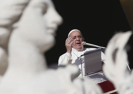 Pope Francis gestures as he leads the Angelus prayer in Saint Peter's Square at the Vatican January 1, 2015. REUTERS/Alessandro Bianchi