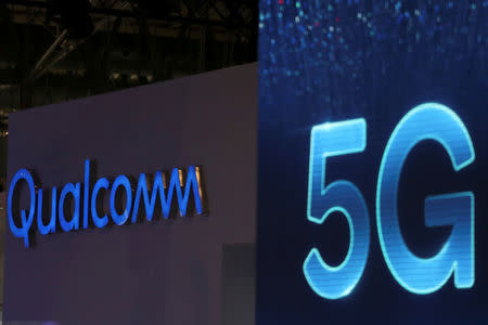 FILE PHOTO: Qualcomm and 5G logos are seen at the Mobile World Congress in Barcelona, Spain, February 26, 2019. REUTERS/Sergio Perez /File Photo