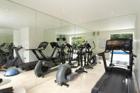 <p>The pool house gym is a perfect workout space - but we wouldn’t suggest doing your exercises in the nuddy…</p>