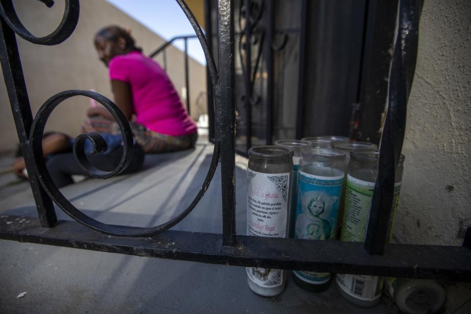 Candles alongside a railing