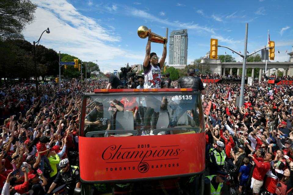 Toronto Raptors basketball player Kyle Lowry celebrates with fans during the Raptors victory parade after defeating the Golden State Warriors in the 2019 NBA Finals, in Toronto, Ontario, Canada June 17, 2019.    REUTERS/Moe Doiron