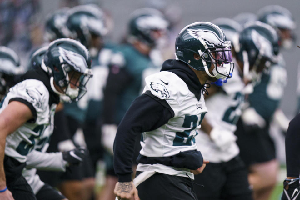 Philadelphia Eagles players warm up during NFL football workout, Thursday, Jan. 26, 2023, in Philadelphia. The Eagles are scheduled to play the San Francisco 49ers Sunday in the NFC championship game.(AP Photo/Chris Szagola)