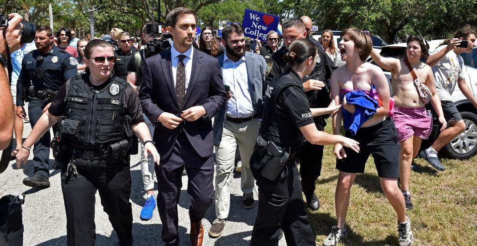 After Gov. Ron DeSantis signed three bills into legislation, Christopher Rufo, one of the six new trustees went over to visit with the protesters who got unruly and was he eventually escorted by police while the protesters virtually surrounded him while leaving the New College of Florida's campus to have lunch, on Monday May 15, 2023.