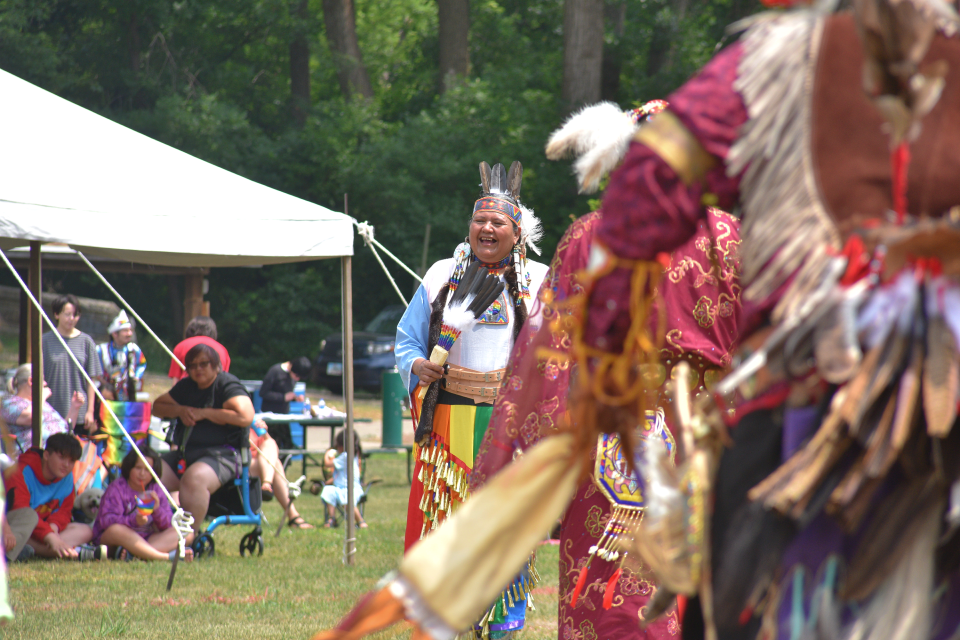 Felipa De Leon-Lousseua, center, laughs while taking part in an intertribal dance on Saturday, June 17, 2023. South Dakota Urban Indian Health hosted their second Sioux Falls Two-Spirit Wacipi at Elmwood Park, and organizers were pleased to see it grow in attendance this year.