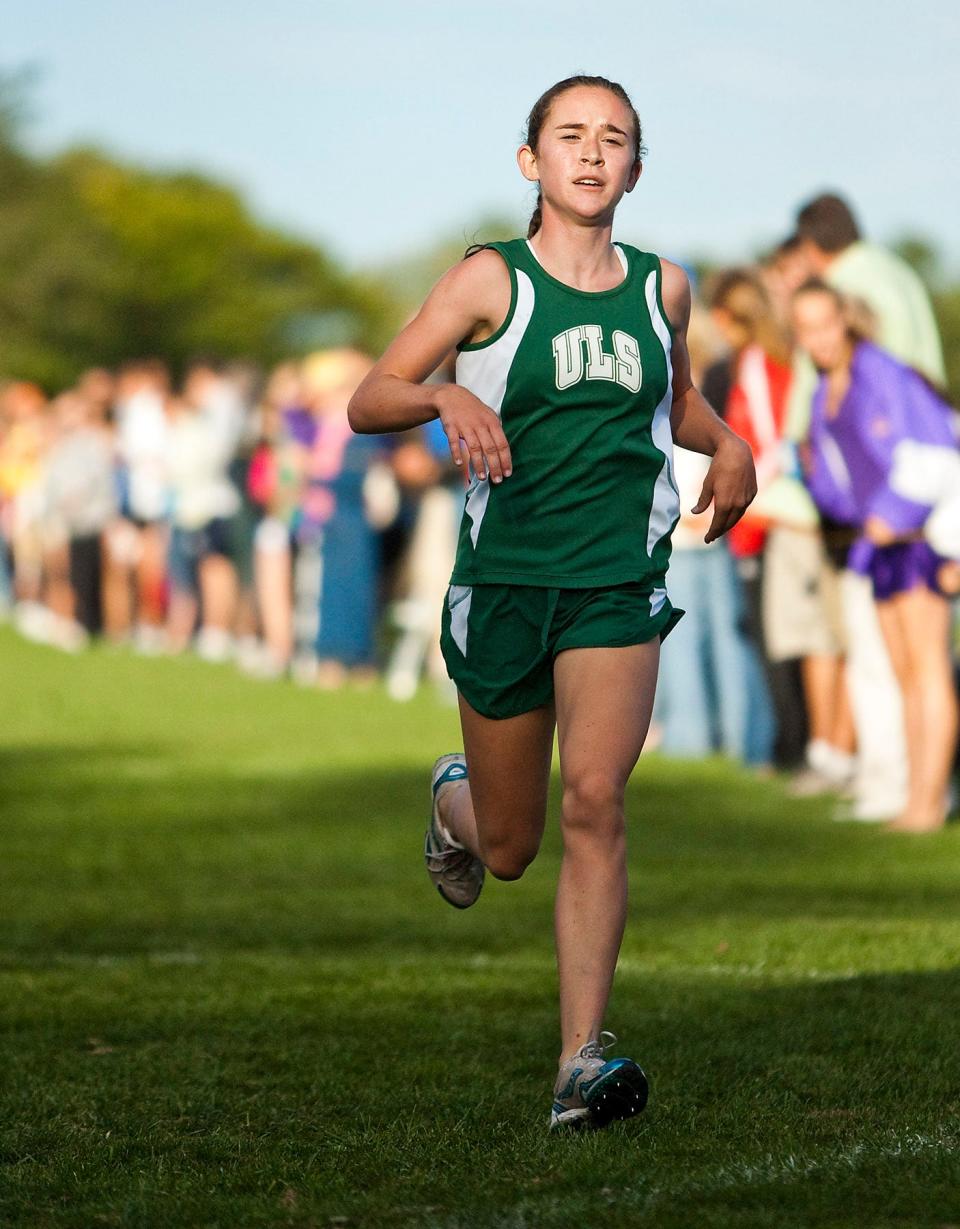 A huge crowd looks on as University Lake School junior Molly Seidel wins the 4,000-meter race with a blistering time of 14:05 at the 25th annual Arrowhead Cross Country Invite on Sept. 9, 2010.