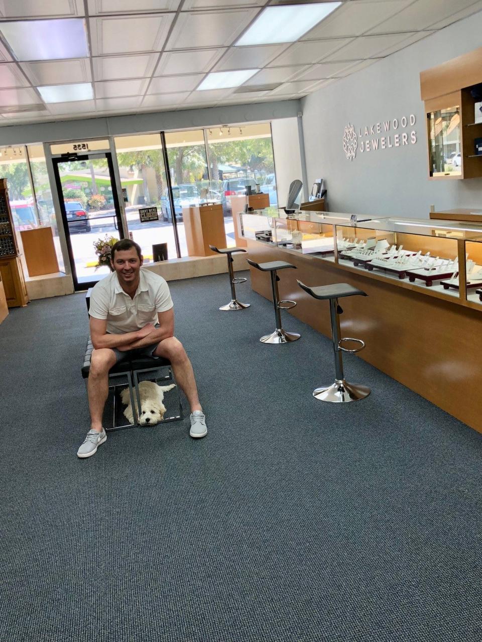Brian Kurz and his dog Ollie, who works as a therapy pet, visit Lakewood Jewelers at its opening day more than four years ago. After he was killed in a car crash, store owners David and Chace Breitmoser worked to restore his wedding ring and a St. Christopher's medal he had been wearing.