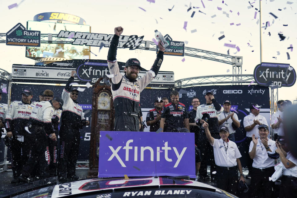 Ryan Blaney celebrates in Victory Lane after winning a NASCAR Cup Series auto race at Martinsville Speedway in Martinsville, Va., Sunday, Oct. 29, 2023. (AP Photo/Chuck Burton)