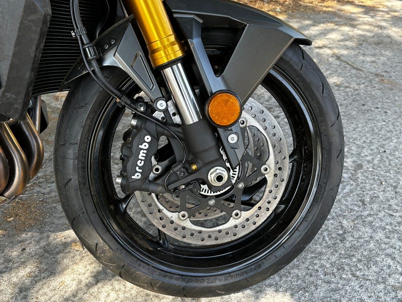 Big Brembo brakes on the front wheel of a 2022 Suzuki GSX-S1000.