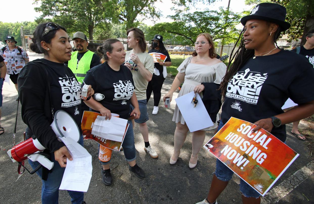 Resident Jenny Navaro, left, speaks with other protesters as they gather to protest in front of Charlotte Hill Mobile Home Park in Charlotte Monday afternoon, June 10, 2024.