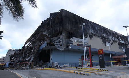 A mall is seen after it was gutted by a fire in Davao city, Philippines, December 29, 2017. REUTERS/Lean Daval Jr