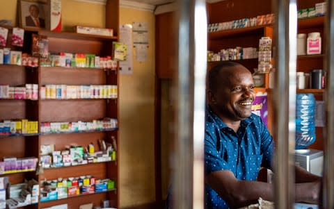 Patrick Ngore, 36, poses for a portrait in his Chemist store in Wangige Town, Kiambu County, Kenya - Credit: Katie G. Nelson&nbsp;/The Telegraph