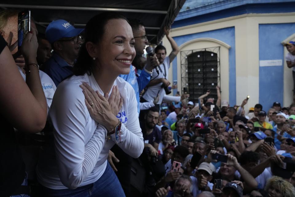 Opposition presidential hopeful Maria Corina Machado gestures to supporters during a rally in Valencia, Carabobo state, Venezuela, Thursday, Oct. 5, 2023. The opposition will hold a primary on Oct. 22. (AP Photo/Ariana Cubillos)