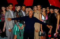 Italian designer Giorgio Armani acknowledges applause at the end of his Spring/Summer 2018 show at the Milan Fashion Week in Milan, Italy, September 22, 2017. REUTERS/Stefano Rellandini