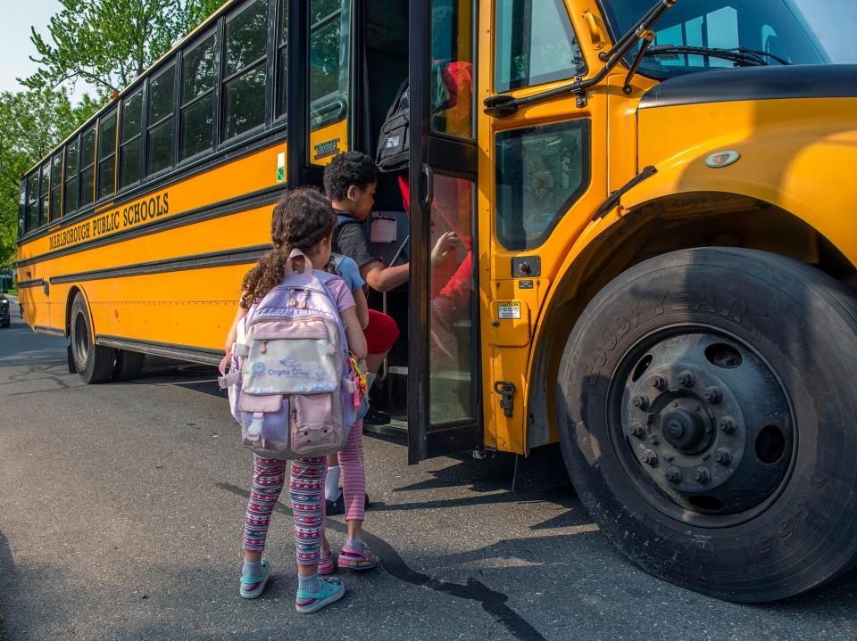 Goodnow Brothers Elementary School students board a school bus on Church Street in Marlborough, May 11, 2023.