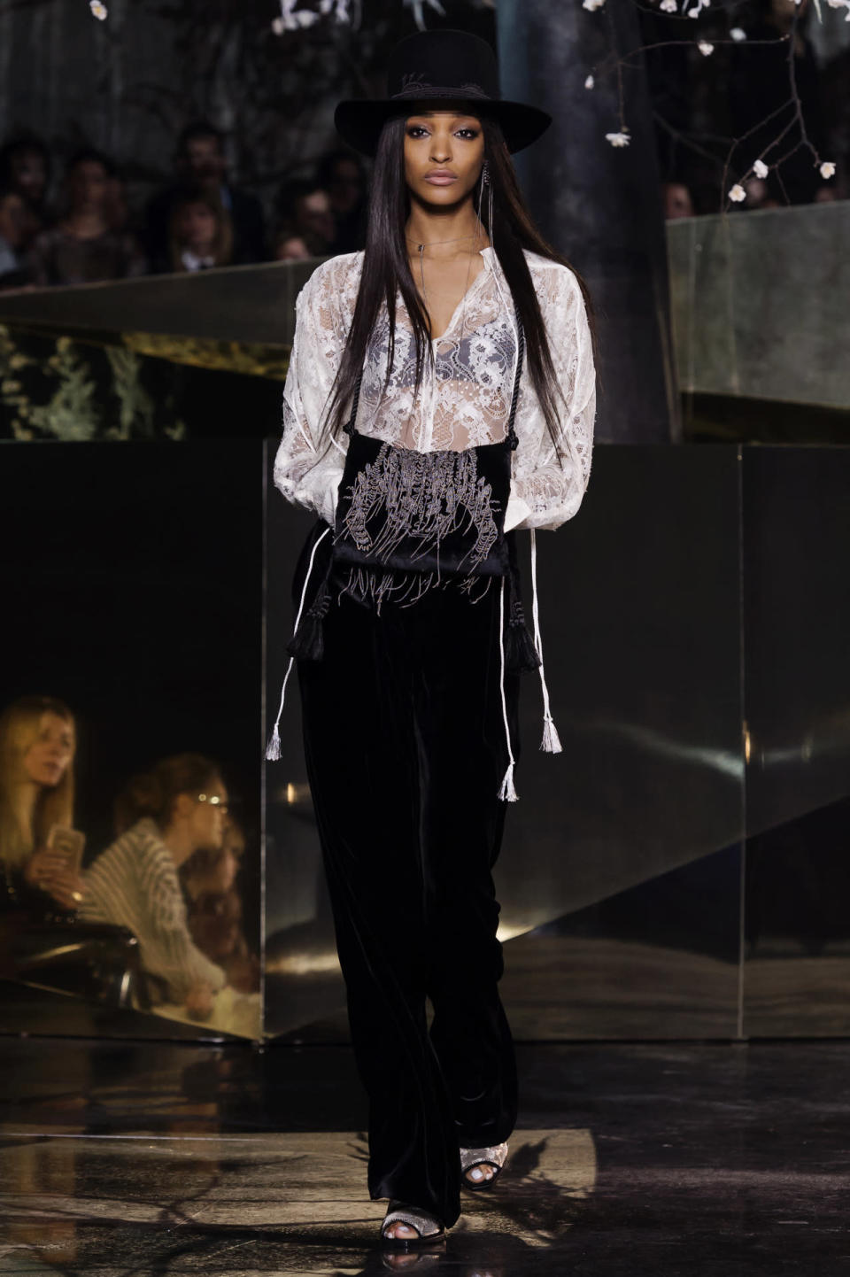 Jourdan Dunn, sporting longer locks than usual, took to the catwalk in a sheer lace blouse and wide-rimmed hat. 