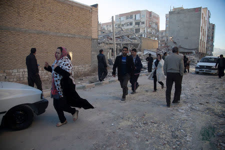 People react as they run following an earthquake in Sarpol-e Zahab county in Kermanshah, Iran. REUTERS/Tasnim News Agency