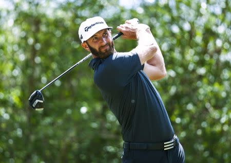 Mar 22, 2018; Austin, TX, USA; Dustin Johnson of the United States tees off on number 12 during the second round of the WGC – Dell Technologies Match Play golf tournament at Austin Country Club. Mandatory Credit: Erich Schlegel-USA TODAY Sports