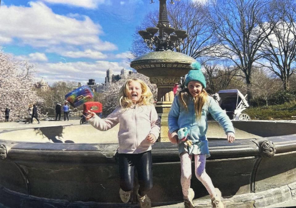 Annie Gotwald, left, and Samantha Gotwald, right, are pictured in front of a fountain in New York City.