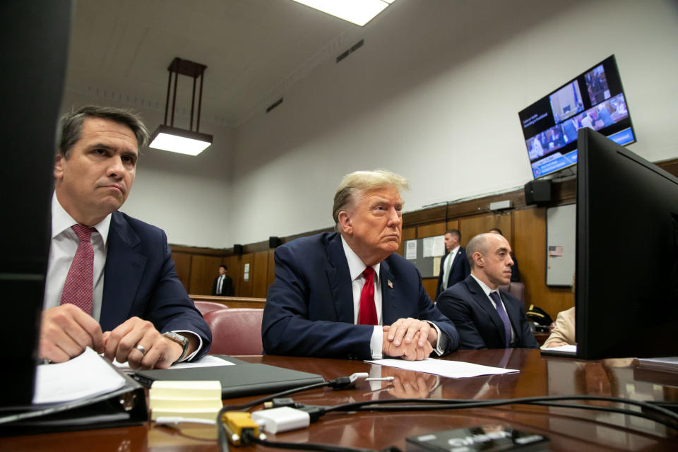 Trump seated in court