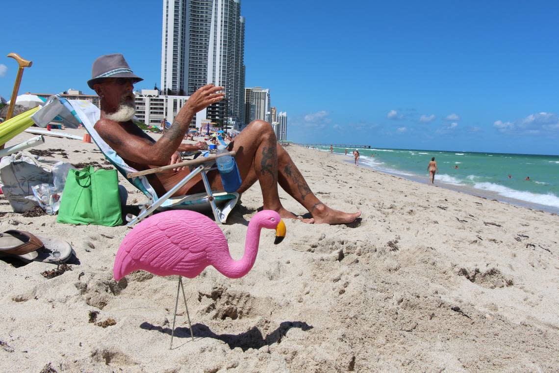 At Haulover, a nude sunbather has the company of a plastic flamingo. Miami Herald File