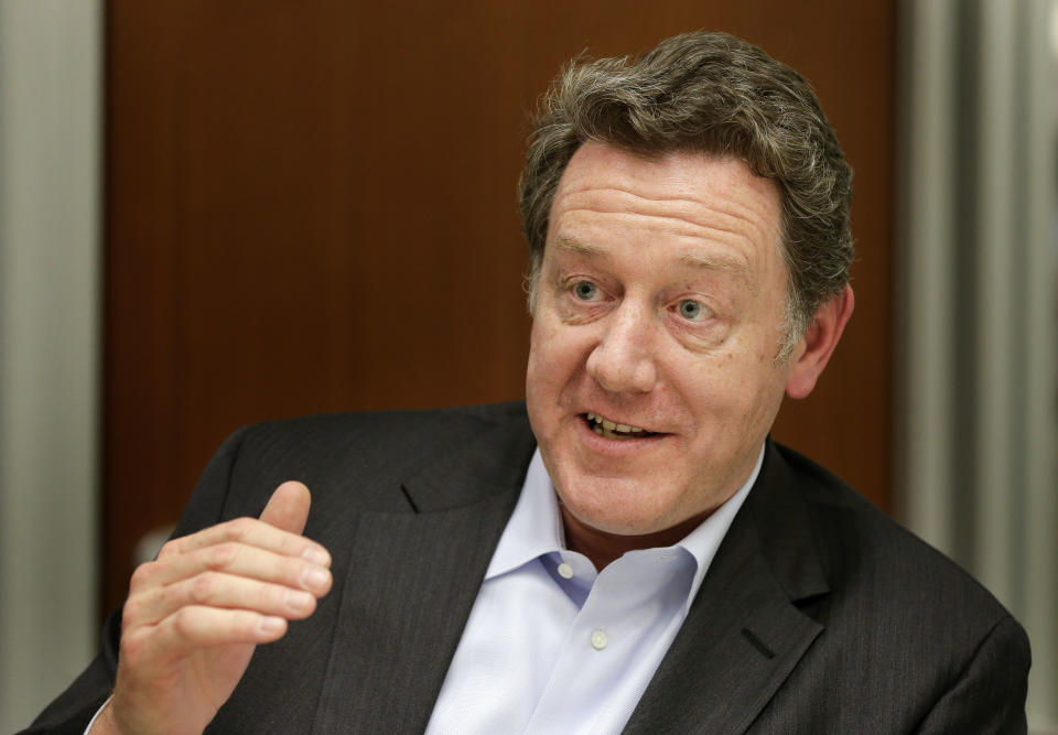 In this Thursday, May 1, 2014 photo, Domino's Pizza CEO Patrick Doyle answers questions during an interview in New York. After having been plagued with a reputation for tasting generic and manufactured, the Ann Arbor, Mich.-based chain has been enjoying strong sales and growth overseas boasting nearly 6,000 international locations. (AP Photo/Julie Jacobson)