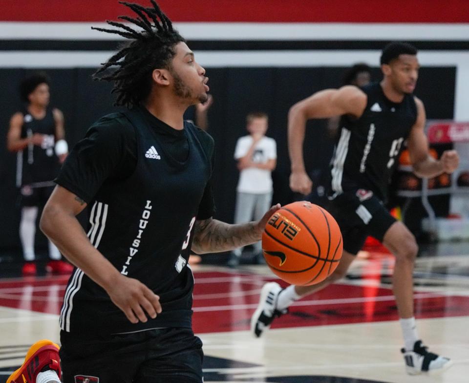 Koren Johnson dribbles on the court during practice before the Cards head to the Bahamas. July 26, 2024