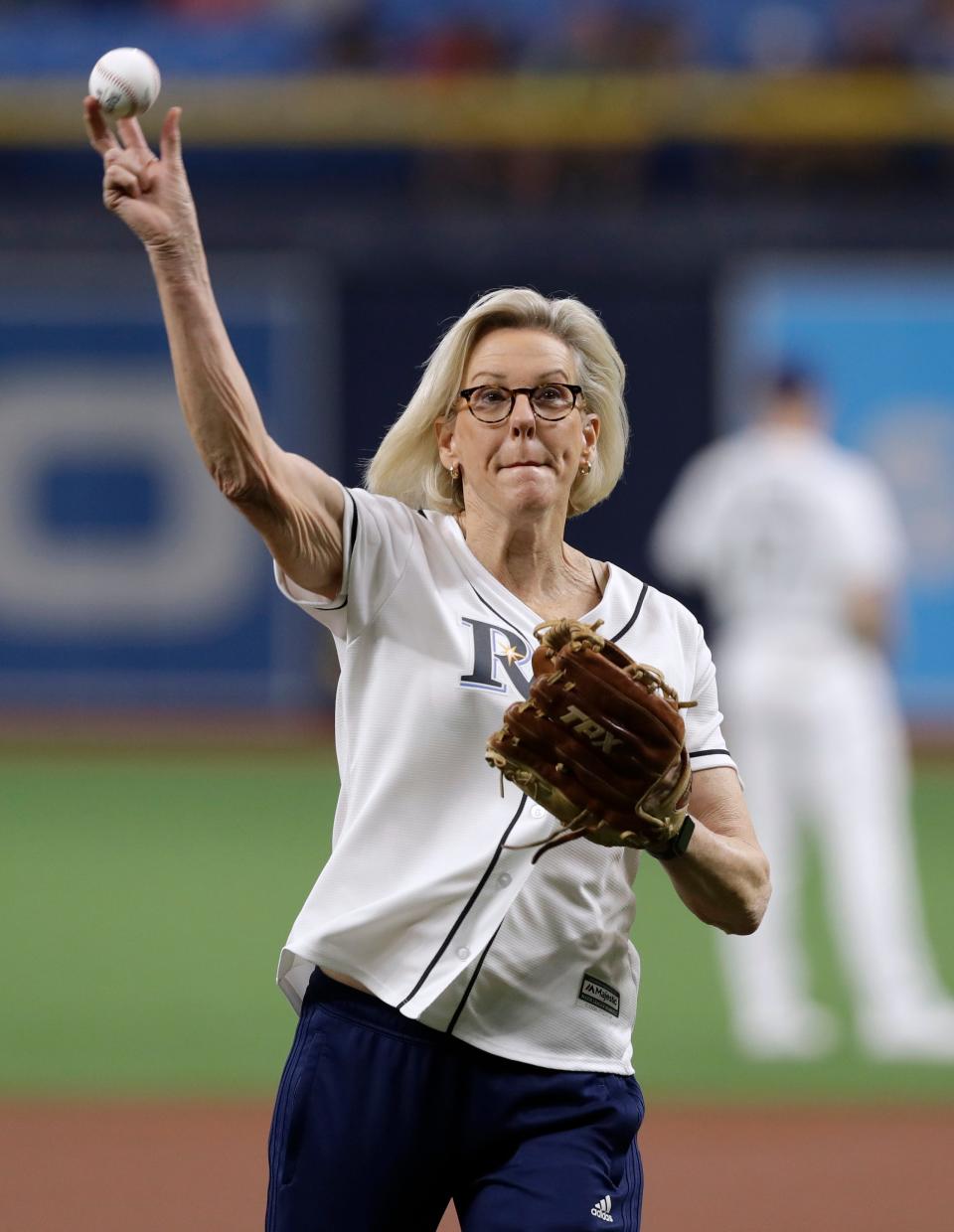 Tampa, Fla., Mayor Jane Castor throws out the ceremonial first pitch before a baseball game between the Tampa Bay Rays and the Los Angeles Angels on Friday, June 14, 2019, in St. Petersburg, Fla. Castor is Tampa's first LGBTQ mayor. The Rays were celebrating Pride Night. (AP Photo/Chris O'Meara)