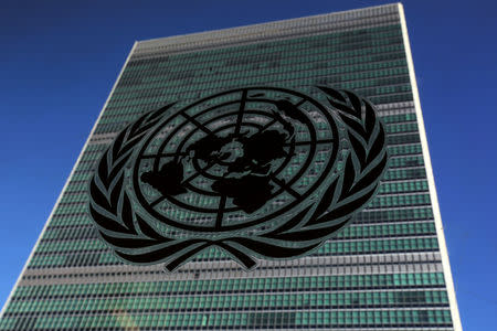 FILE PHOTO: The United Nations logo is pictured in front of the United Nations Headquarters building during the 71st United Nations General Assembly in the Manhattan borough of New York, U.S., September 22, 2016. REUTERS/Carlo Allegri