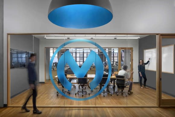The MuleSoft logo on a glass wall in MuleSoft's offices.