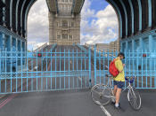 Tower Bridge crossing the River Thames is stuck open, leaving traffic in chaos as the iconic river crossing remains open, in London, Saturday Aug. 22, 2020. The historic bridge has failed to close Saturday after opening to allow ships to pass underneath on the River Thames. (AP Photo / Tony Hicks)