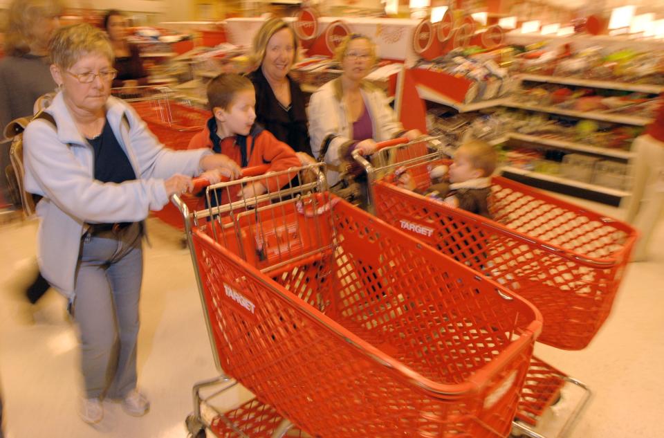Shoppers grab their carts and head down the isles at the 6 a.m. opening of Target at the St. Johns Town Center on Black Friday, Nov. 23, 2007.