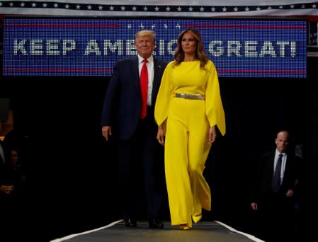 U.S. President Donald Trump and first lady Melania Trump arrive on stage to formally kick off his re-election bid with a campaign rally in Orlando