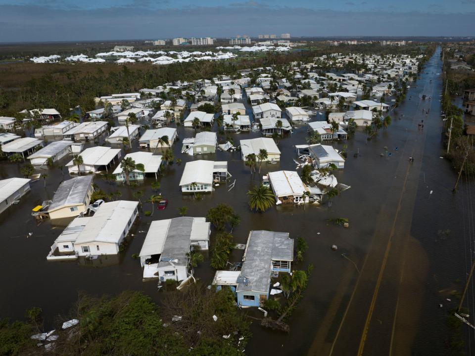  An aerial picture taken on September 29, 2022 shows a flooded neighborhood in the aftermath of Hurricane Ian in Fort Myers, Florida. 