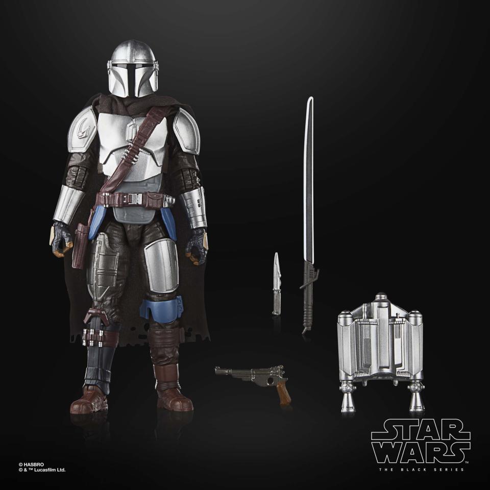 The Mandalorian action figure posed against a black background