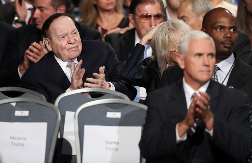 Businessman Sheldon Adelson (L) and Republican candidate for Vice President Mike Penceapplaude before the first presidential debate at Hofstra University in Hempstead, New York on September 26, 2016. Hillary Clinton and Donald Trump face off in one of the most consequential presidential debates in modern US history with up to 100 million viewers set to tune in. / AFP / POOL / joe raedle        (Photo credit should read JOE RAEDLE/AFP/Getty Images)