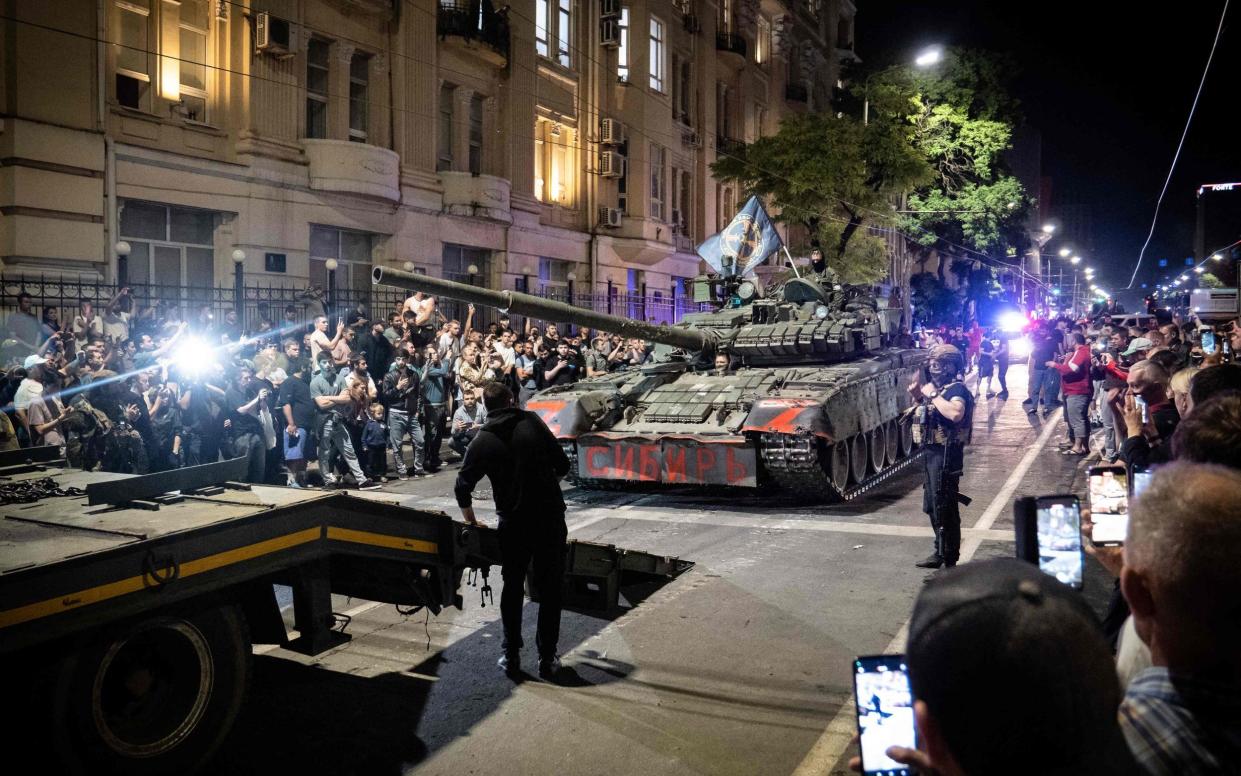 Members of Wagner Group prepare to pull out from the headquarters of the Southern Military District to return to their base in Rostov-on-Don late on Saturday