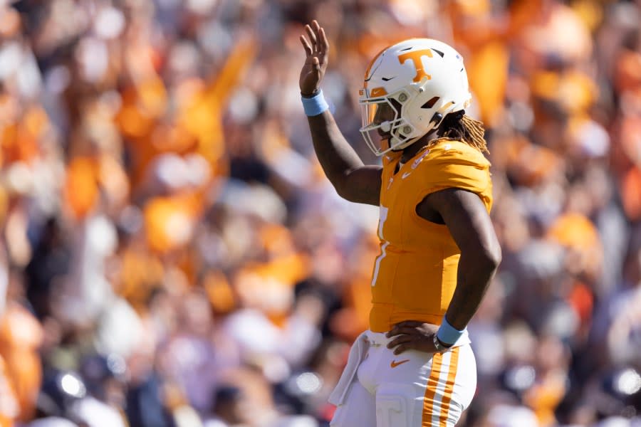 Tennessee quarterback Joe Milton III (7) waves to fans after a touchdown run by Jaylen Wright during the first half of an NCAA college football game against UConn, Saturday, Nov. 4, 2023, in Knoxville, Tenn. (AP Photo/Wade Payne)