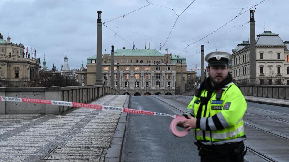 PHOTO: A police officer cordon off an area near the university in central Prague, Dec. 21, 2023.  (Michal Cizek/AFP via Getty Images)