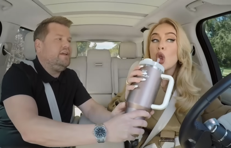 Adele drinks from her Stanley cup during carpool karaoke in 2023 (The Late Late Show)