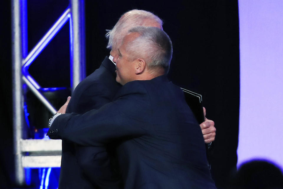 Former Vice President Joe Biden and union leader Lonnie Stephenson exchange a consensual hug. (Photo: ASSOCIATED PRESS)