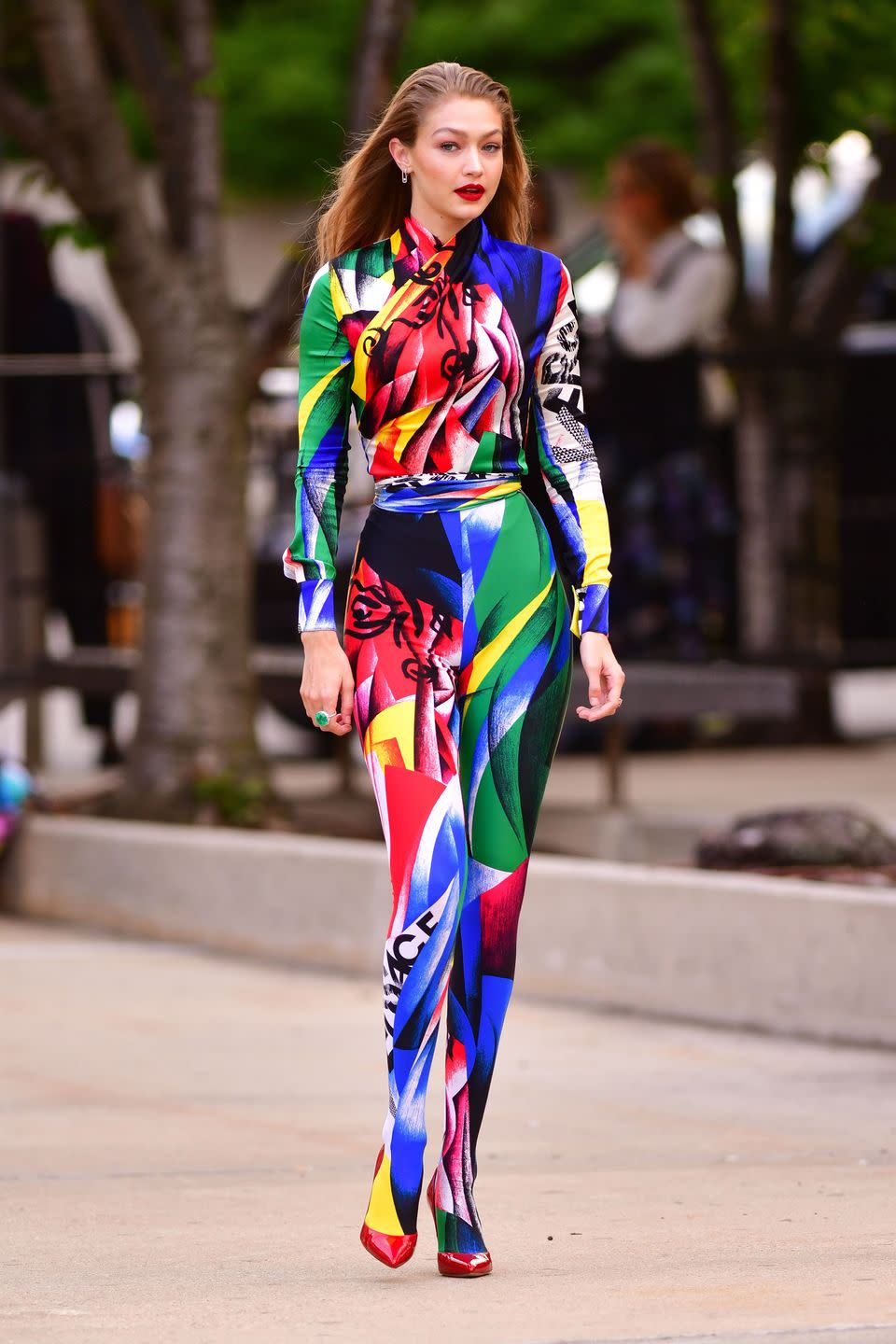 <p>In colorful Versace catsuit and red pumps while attending the 2018 CFDA Awards</p>