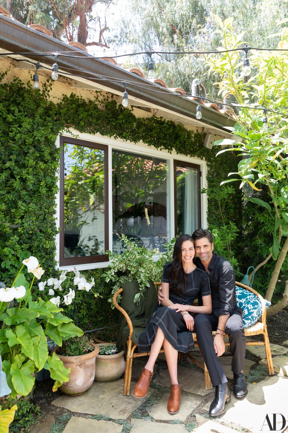 John and Caitlin Stamos, outside their Spanish-style residence in Los Angeles.