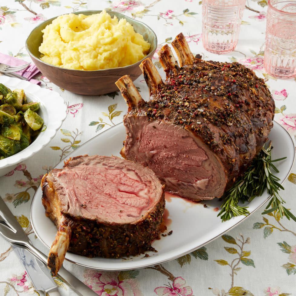 easter recipes prime rib on platter with mashed potatoes in back