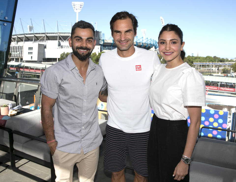 Indian cricket captain Virat Kohli, left, and his wife Anushka Sharma pose for a photo with Switzerland's Roger Federer at the Australian Open tennis championships in Melbourne, Australia, Saturday, Jan. 19, 2019. (Fiona Hamilton/Tennis Australia via AP)