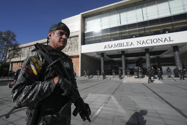 Police guard the National Assembly in Quito, Ecuador, Wednesday, May 17, 2023. Ecuadorian President Guillermo Lasso on Wednesday put an end to impeachment proceedings against him by dissolving the opposition-led National Assembly, which had accused him of embezzlement. (AP Photo/Dolores Ochoa)
