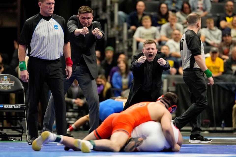 Joe Dubuque (right), shown during Pat Glory's 125-pound NCAA Tournament semifinal bout in 2022, was named Princeton University's head wrestling coach Tuesday.