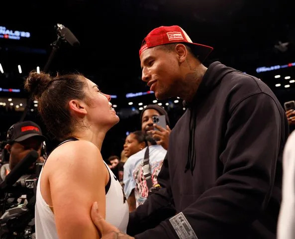 <p>Sarah Stier/Getty</p> Kelsey Plum #10 of the Las Vegas Aces reacts with husband Darren Waller after defeating the New York Liberty during Game Four of the 2023 WNBA Finals at Barclays Center on October 18, 2023 in New York City.