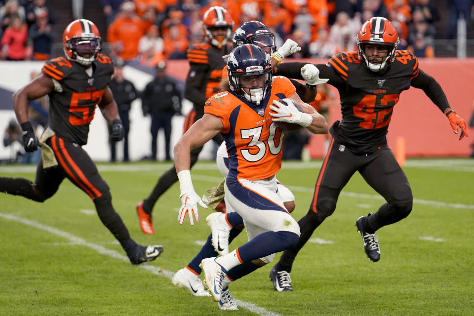 Denver Broncos running back Phillip Lindsay (30) runs for a 30-yard touchdown against the Cleveland Browns during the second half of NFL football game, Sunday, Nov. 3, 2019, in Denver. (AP Photo/Jack Dempsey)