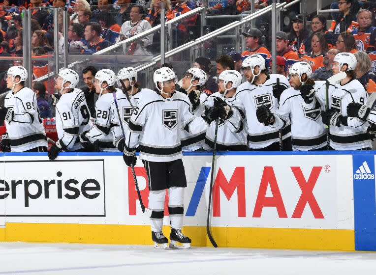 The Kings' Quinton Byfield celebrates at the bench after scoring a third-period goal at Edmonton in Game 5 on April 25, 2023.